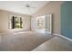 Inviting living room with a large window providing abundant natural light and an open entryway at 9144 Bassett Ln, New Port Richey, FL 34655