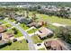 Birds eye view of a residential area with a large sand trap beside homes with pools at 9630 Southern Belle Dr, Weeki Wachee, FL 34613