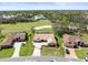 Stunning aerial view of a home with a tile roof overlooking a lush golf course at 9630 Southern Belle Dr, Weeki Wachee, FL 34613