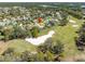 Wonderful aerial of a neighborhood with homes surrounding a lush green golf course at 9630 Southern Belle Dr, Weeki Wachee, FL 34613