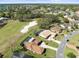An aerial view of a residential neighborhood featuring golf course, mature trees, and private pools at 9630 Southern Belle Dr, Weeki Wachee, FL 34613
