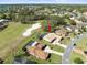 A sprawling residential area with lush greenery, a sand trap, and neighborhood pools at 9630 Southern Belle Dr, Weeki Wachee, FL 34613