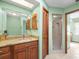 Well-maintained bathroom with granite countertops, a large mirror and a walk-in shower at 9630 Southern Belle Dr, Weeki Wachee, FL 34613