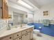 Spacious bathroom featuring tile flooring and ample counter space at 9630 Southern Belle Dr, Weeki Wachee, FL 34613