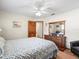 Comfortable bedroom with wood dresser and decor, creating a cozy and inviting space at 9630 Southern Belle Dr, Weeki Wachee, FL 34613