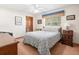 Bright bedroom with comfortable bed and neutral walls and decor at 9630 Southern Belle Dr, Weeki Wachee, FL 34613