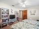 Charming bedroom featuring two beds, open door, and built-in bookshelves perfect for storage at 9630 Southern Belle Dr, Weeki Wachee, FL 34613