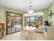 Light-filled breakfast nook with sliding door access to the pool and patio at 9630 Southern Belle Dr, Weeki Wachee, FL 34613