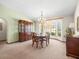 Elegant dining room with ample natural light from large bay windows at 9630 Southern Belle Dr, Weeki Wachee, FL 34613