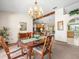 Inviting dining room with a wood table and a view of the living area at 9630 Southern Belle Dr, Weeki Wachee, FL 34613