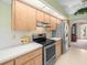 Spacious kitchen with wooden cabinets, white countertops, and stainless steel appliances at 9630 Southern Belle Dr, Weeki Wachee, FL 34613