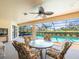 Relaxing lanai with seating area overlooking the sparkling pool and lush backyard at 9630 Southern Belle Dr, Weeki Wachee, FL 34613