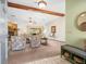 Warm, inviting living room featuring exposed wood beams and a stone fireplace at 9630 Southern Belle Dr, Weeki Wachee, FL 34613