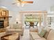 Cozy living room with neutral furniture and view of the outdoor pool at 9630 Southern Belle Dr, Weeki Wachee, FL 34613