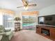 Inviting living area with view of the pool and outdoor space through sliding glass doors at 9630 Southern Belle Dr, Weeki Wachee, FL 34613