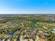 A scenic aerial view of the neighborhood with lakes and lush green trees at 11023 Silver Dancer Dr, Riverview, FL 33579