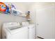 Well-lit laundry room with a modern washer and dryer set at 11023 Silver Dancer Dr, Riverview, FL 33579