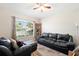 Comfortable living room with a large window and a cozy seating arrangement, perfect for relaxation at 11023 Silver Dancer Dr, Riverview, FL 33579