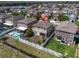 High angle aerial view showing the property with a swimming pool and fenced backyard at 11895 Crestridge Loop, New Port Richey, FL 34655