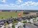 Beautiful aerial view of a modern home in a peaceful, tree-lined neighborhood at 11895 Crestridge Loop, New Port Richey, FL 34655