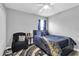 Cozy bedroom with a modern color palette, accent rug, and comfortable seating at 11895 Crestridge Loop, New Port Richey, FL 34655