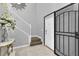 Bright foyer with tile flooring, staircase, and a security screen on the front door at 11895 Crestridge Loop, New Port Richey, FL 34655