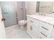 Bathroom featuring a vanity, toilet, and glass-enclosed shower at 1223 Queen Anne Dr # B, Palm Harbor, FL 34684