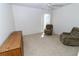 Bedroom with neutral colored walls, furnishings, and a window at 1223 Queen Anne Dr # B, Palm Harbor, FL 34684