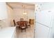 Charming eat-in kitchen area featuring classic furnishings at 1223 Queen Anne Dr # B, Palm Harbor, FL 34684