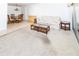 Inviting living room featuring neutral carpet, a dining area, and access to a bright screened lanai at 1223 Queen Anne Dr # B, Palm Harbor, FL 34684