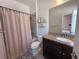 Bathroom featuring tub/shower combination with granite countertop vanity at 12403 Coralbean Ct, New Port Richey, FL 34654