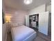 Bedroom featuring wood-look flooring, modern accents, and a closet with organizers at 12403 Coralbean Ct, New Port Richey, FL 34654