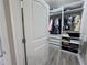 Walk-in closet with custom shelving and organization; ample storage space at 12403 Coralbean Ct, New Port Richey, FL 34654
