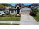 Attractive one-story home with a two-car garage and landscaped front yard at 12403 Coralbean Ct, New Port Richey, FL 34654