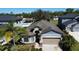 Charming single-Gathering home with a well-manicured front yard and neutral-toned exterior at 12403 Coralbean Ct, New Port Richey, FL 34654