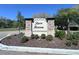 Rose Haven community sign with stone accents and lush landscaping at 12403 Coralbean Ct, New Port Richey, FL 34654