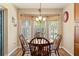 Charming breakfast nook with wood table, chair accents, and decorative window treatments at 1281 Bolander Ave, Spring Hill, FL 34609