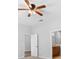 Bedroom featuring ceiling fan and view into bathroom at 13043 Moonstone Way, Spring Hill, FL 34609