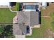 Aerial view of property showing landscaping, pool, patio and outbuildings on spacious lot at 13045 Marbled Godwit Rd, Weeki Wachee, FL 34614