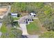 Spacious property with manicured landscaping, several outbuildings and a home featuring a two-car garage at 13045 Marbled Godwit Rd, Weeki Wachee, FL 34614
