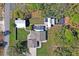 Birds eye view of property with pool and outbuildings on spacious lot at 13045 Marbled Godwit Rd, Weeki Wachee, FL 34614