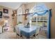 Bright dining area with large arched windows and elegant decor at 13045 Marbled Godwit Rd, Weeki Wachee, FL 34614