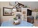Bright dining room with modern lighting fixtures and view of the kitchen at 13045 Marbled Godwit Rd, Weeki Wachee, FL 34614