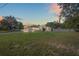 Beautiful home at sunset featuring a manicured lawn and welcoming front entrance at 13045 Marbled Godwit Rd, Weeki Wachee, FL 34614
