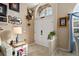 Welcoming foyer with elegant décor and lots of light at 13045 Marbled Godwit Rd, Weeki Wachee, FL 34614