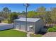 Detached garage and workshop for hobbies and storage on a lot with well maintained landscaping at 13045 Marbled Godwit Rd, Weeki Wachee, FL 34614