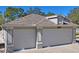 Attached two-car garage offers ample parking and storage space for vehicles and other belongings at 13045 Marbled Godwit Rd, Weeki Wachee, FL 34614