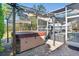 Relax in the outdoor hot tub, with a covered pergola, and a clear view of the pool at 13045 Marbled Godwit Rd, Weeki Wachee, FL 34614