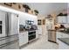 Modern kitchen with stainless steel appliances, white cabinetry, and granite countertops at 13045 Marbled Godwit Rd, Weeki Wachee, FL 34614