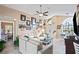 Open living area with white sofa, arched windows, and decorative elements creating a welcoming space at 13045 Marbled Godwit Rd, Weeki Wachee, FL 34614